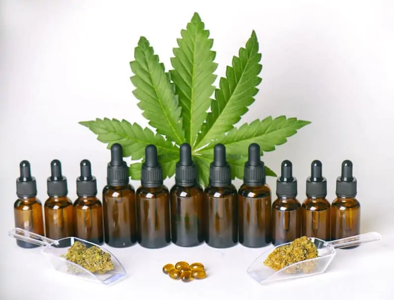 brown tincture bottles with cannabis seeds and leaf, use of cannabis tinctures