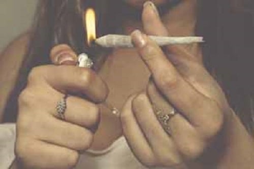 Physical Exercise and the Cannabis Effect 1 Physical Exercise and the Marijuana Effect. Lady lighting blunt.
