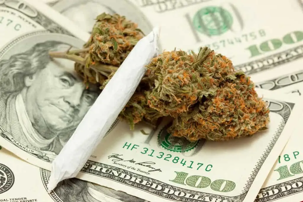 4 Proven Sales Promotions to Make More Money on 4/20. Cannabis on a stack of money.