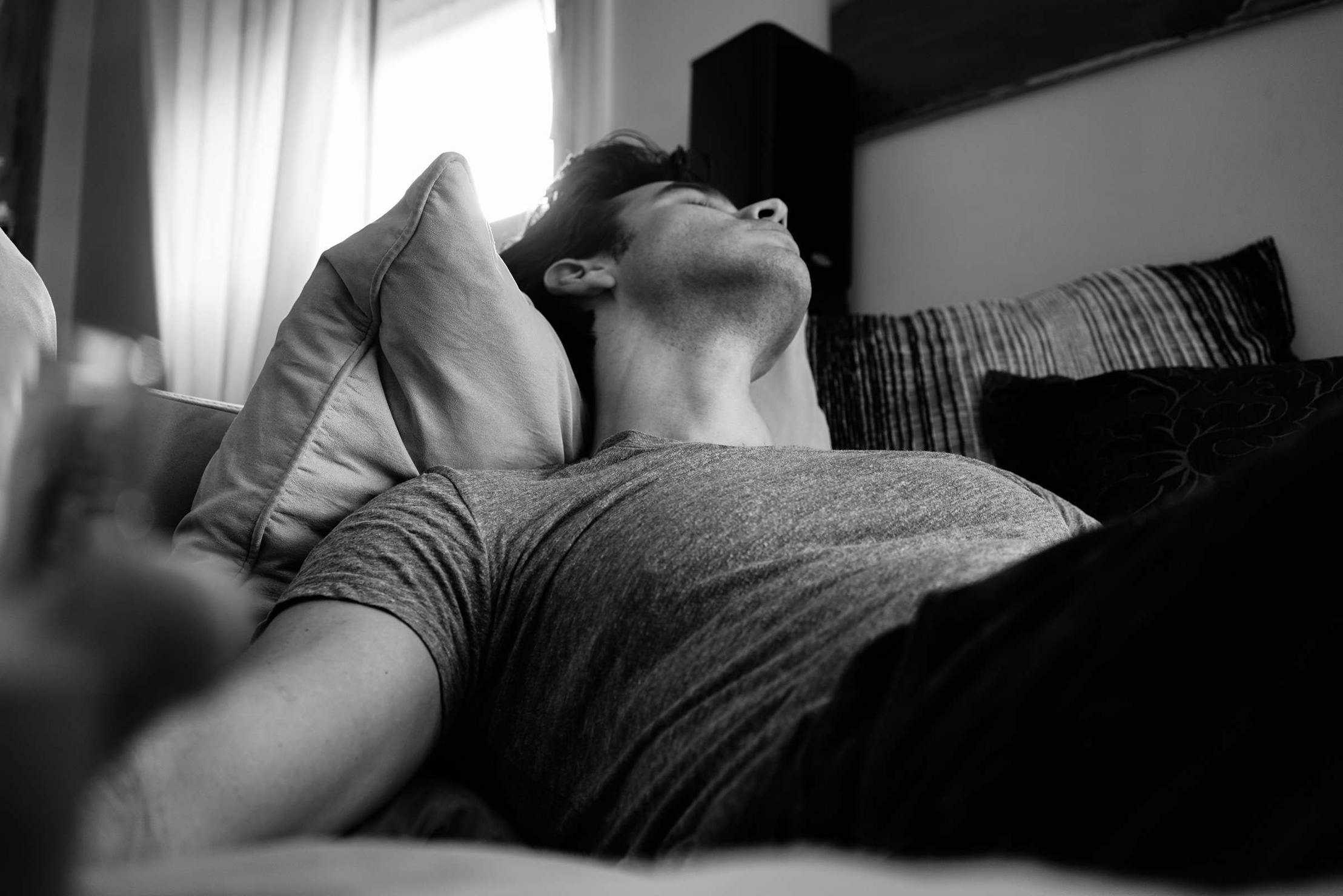 Cannabis Effect on Sleep. Man sleeping on a couch.