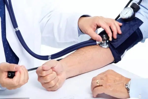 doctor taking blood pressure, cannabis effect and hypertension