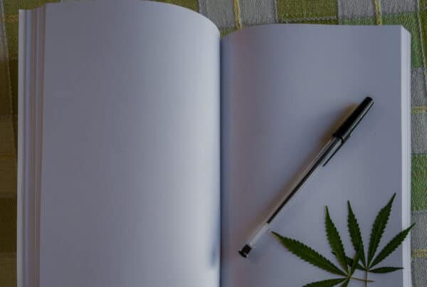 blank book open with a pen and cannabis leaf on it, Columbia marijuana college