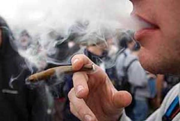 How to Pass a Marijuana Drug Test. Man smoking a blunt.