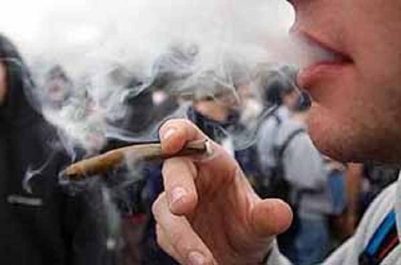 How to Pass a Marijuana Drug Test. Man smoking a blunt.