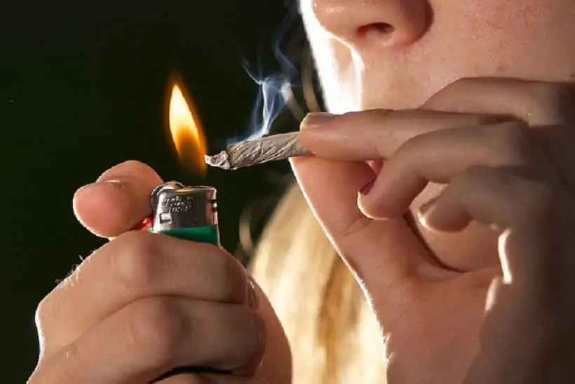 The Best Tricks for How to Not Act High. Lighting a joint.