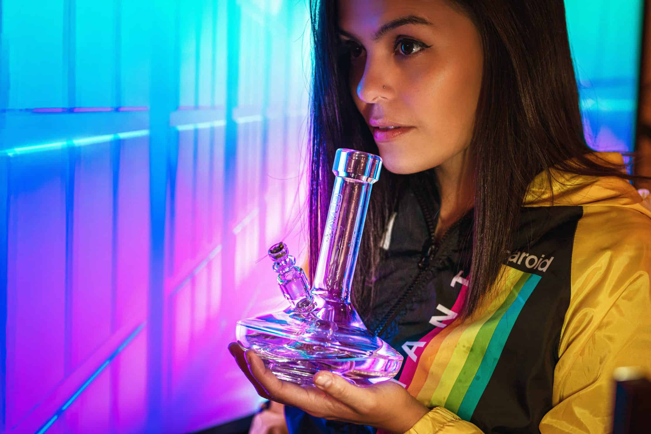 How to Keep Your Weed Bong Clean. Women holding a bong.