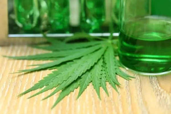 Become a cannabis Laboratory Analyst. Marijuana leaf and glass of green liquid.