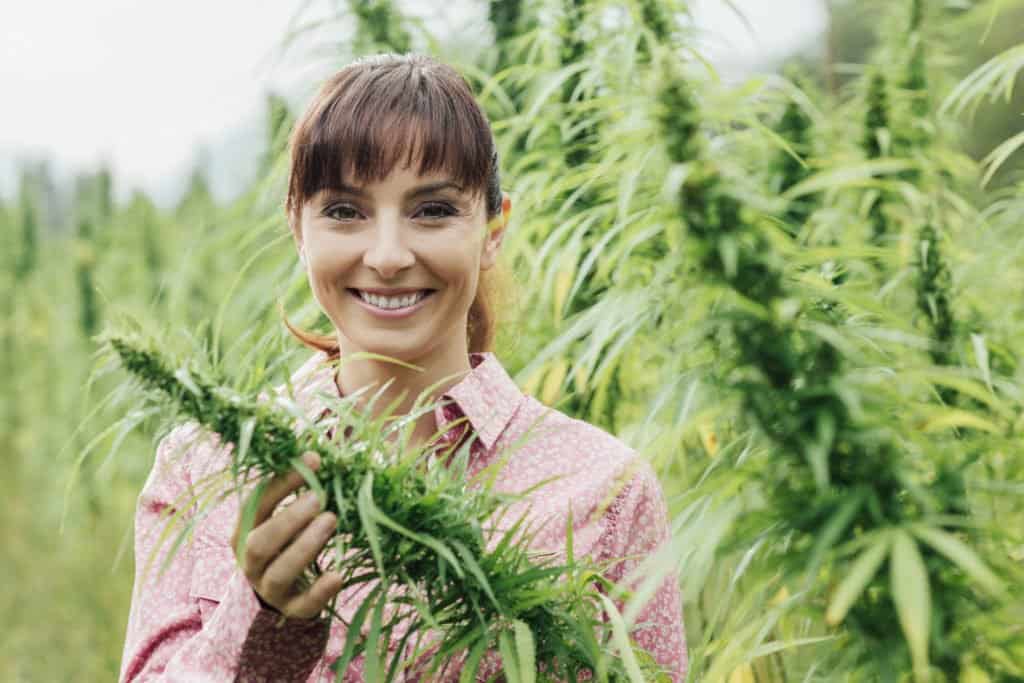 How Marijuana Dispensary Owners Reach Millennials. Women holding marijuana plant. 