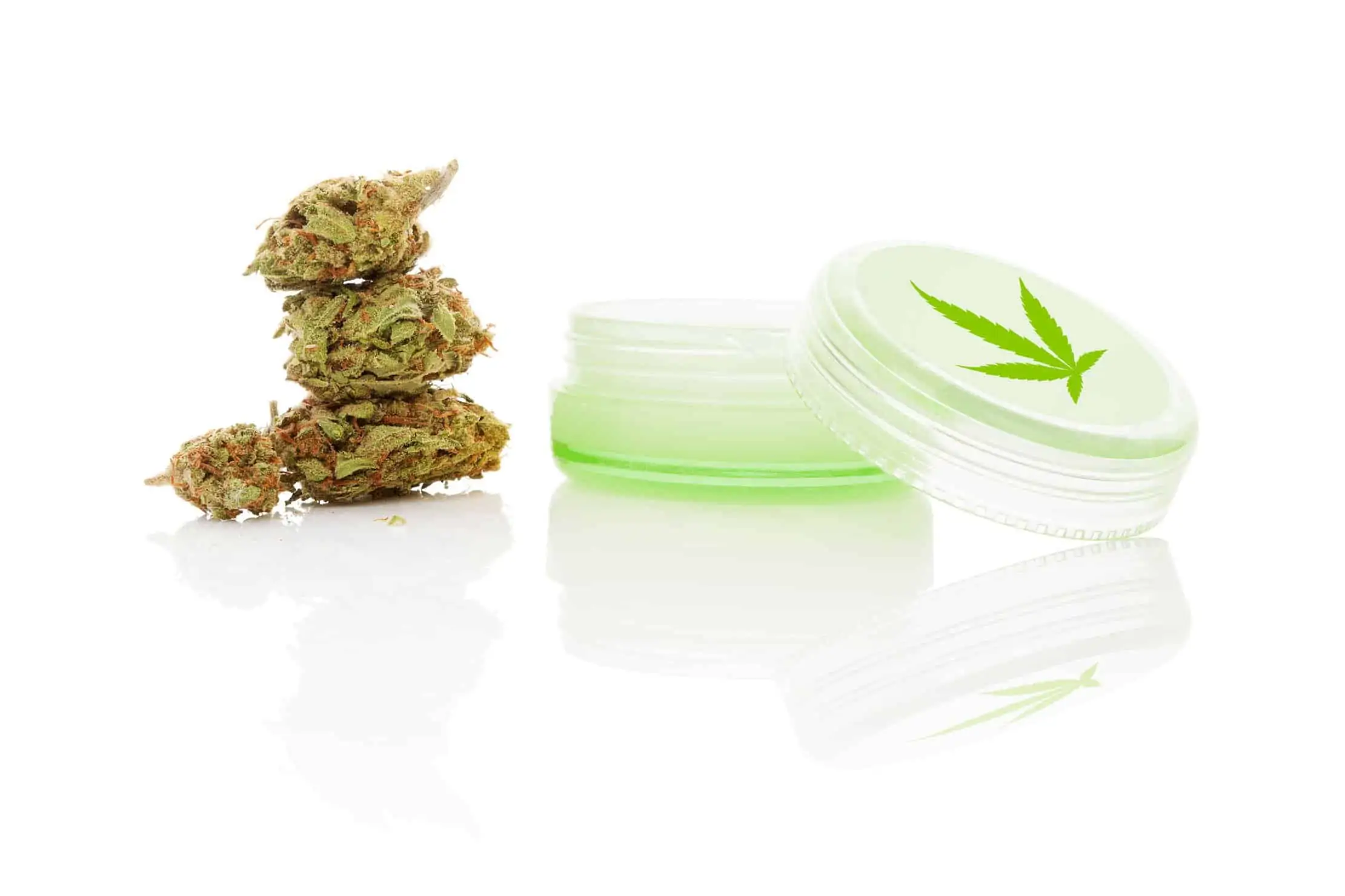Marijuana Topicals: A Closer Look. Marijuana buds and a clear container.