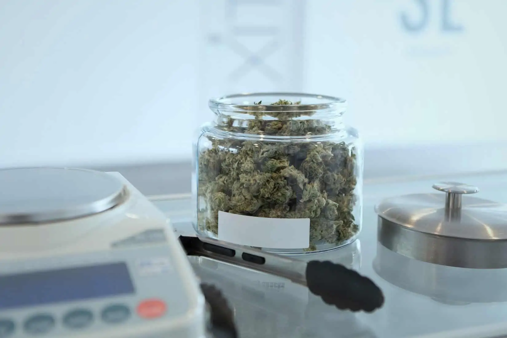 Michigan adult-use cannabis sales. Marijuana in a jar. 