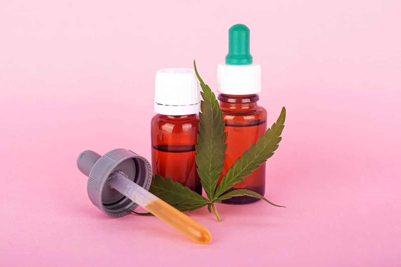 How To Become A Budtender In A Cannabis Dispensary. Tinctures and marijuana leaf.