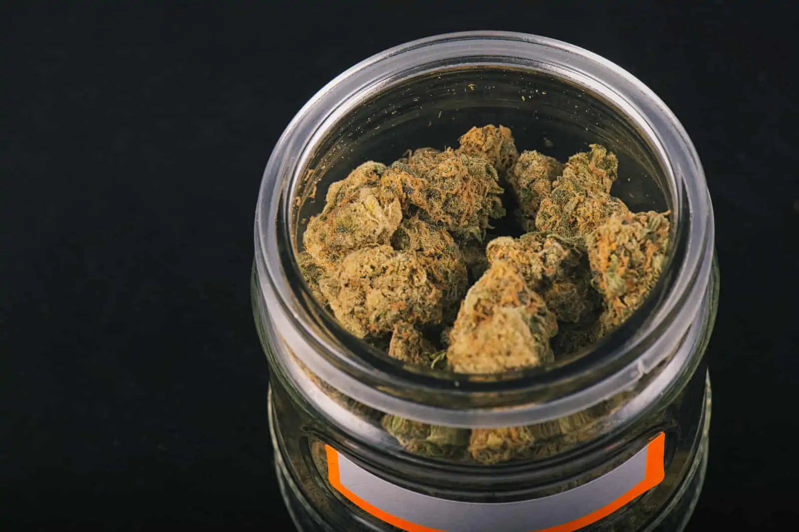 marijuana buds in a glass container, How to Become a Budtender in Nevada