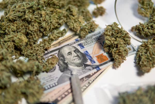 How to Open a Marijuana Dispensary in Oregon. Money with weed on it.