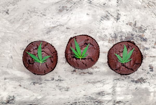 three chocolate cupcakes with weed leaves on them, your guide to weed edibles