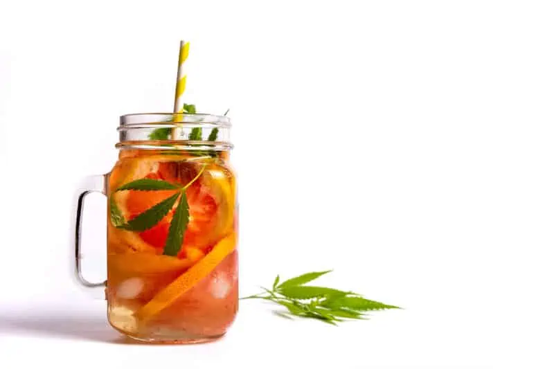 fruity weed cocktail in mason jar isolated on white