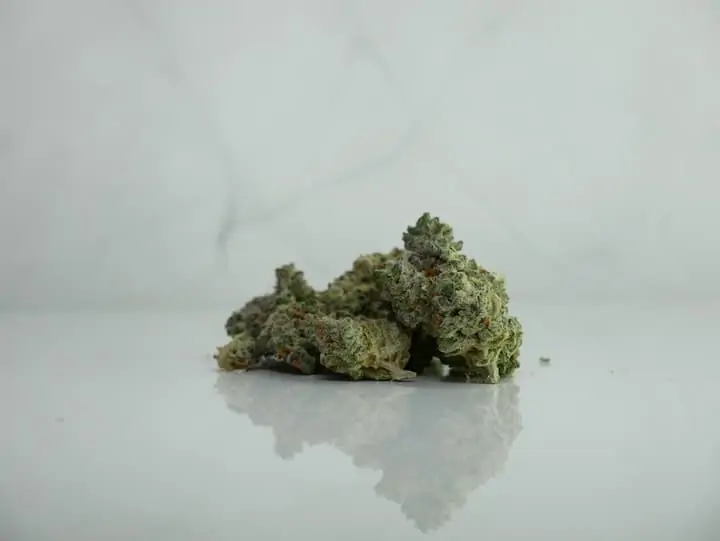 Sativa Strains on a white marble surface.
