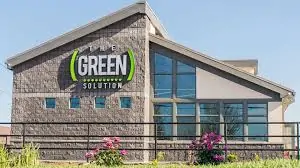 Building with Green Solution sign on it.