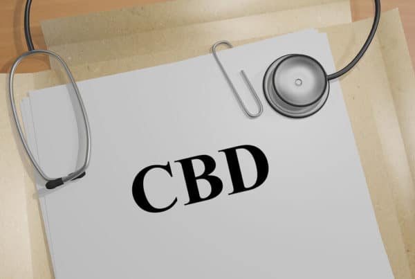 CBD Dosage Chart on a manilla folder with a stethoscope.