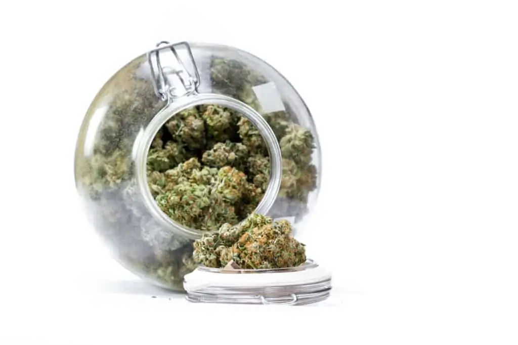 marijuana in a glass jar tipped over, death bubba strain