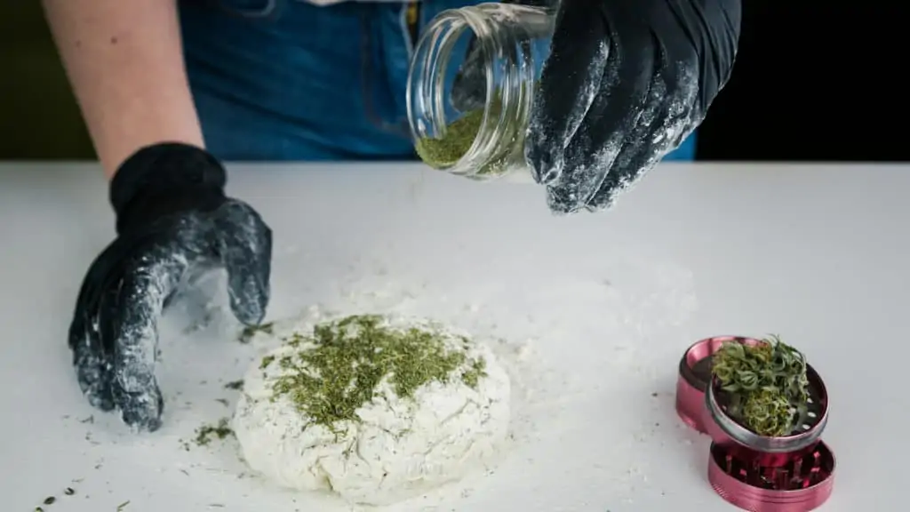 gloved hands sprinting marijuana on dough, marijuana industry jobs