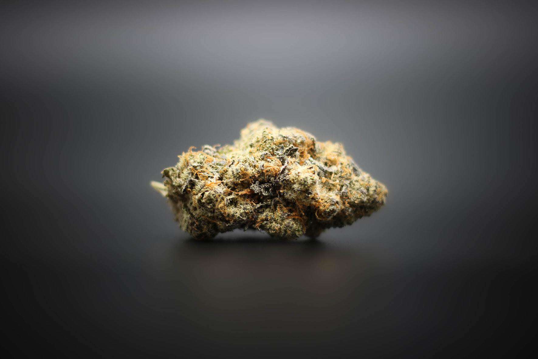 delta 9 strain of cannabis on black surface