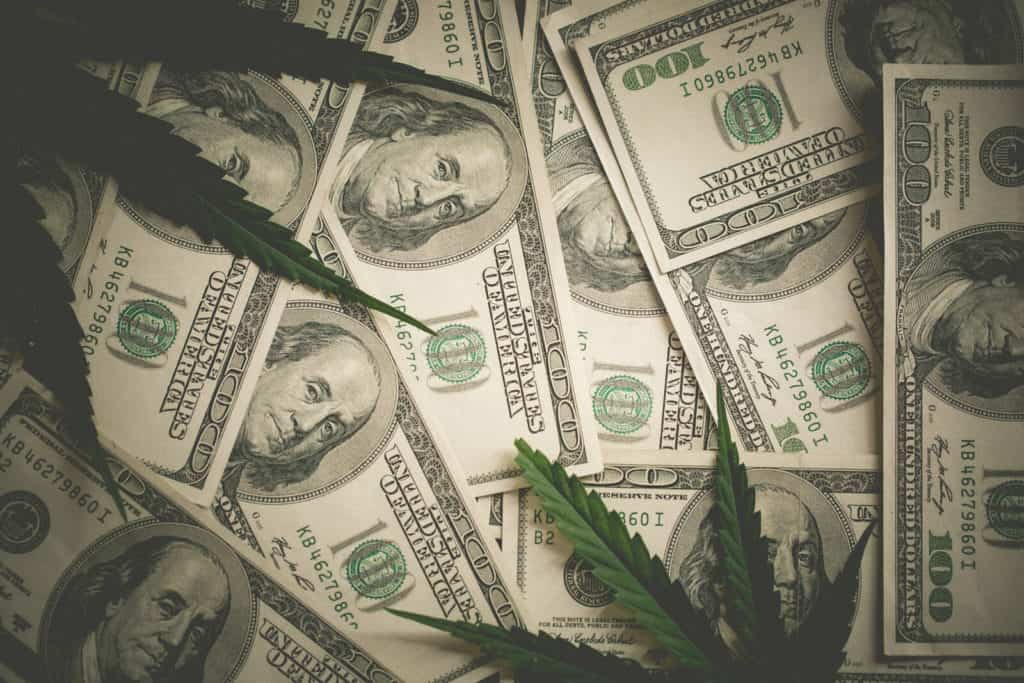 pile of one hundred dollar bill with cannabis leaf, cannabis banking reform
