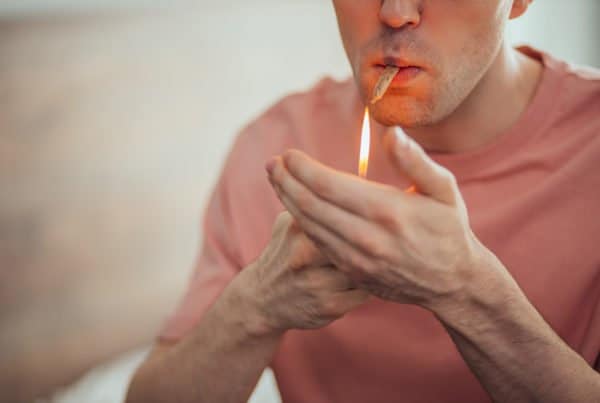 man smoking a joint, how to get rid of weed smell