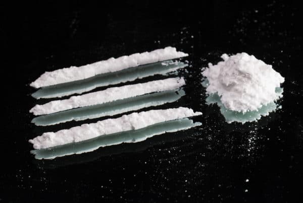 cocaine on a black table, cocaine and marijuana