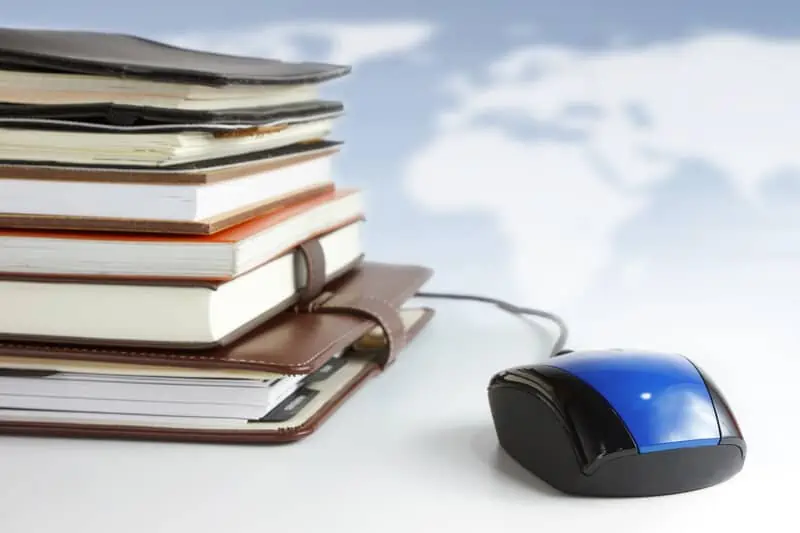 stack of books with a mouse next to them, Missouri cannabis college