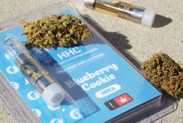 hhc cartridge next to cannabis flower, hhc vs thc