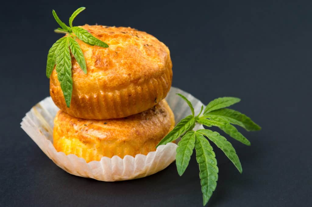 cannabis muffins with cannabis next to them