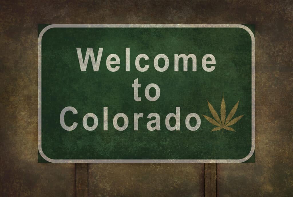 Colorado cannabis college. Welcome to Colorado sign with a marijuana leaf on it.