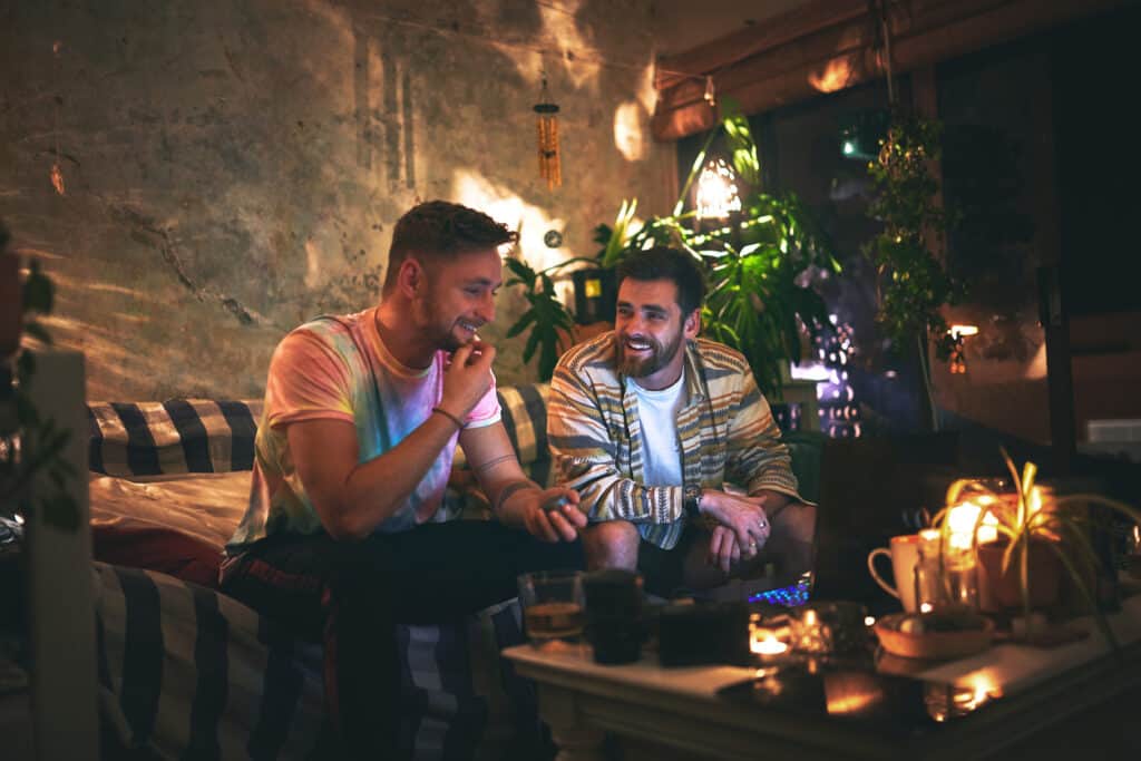 two men enjoying cannabis at a cannabis consumption lounge 
