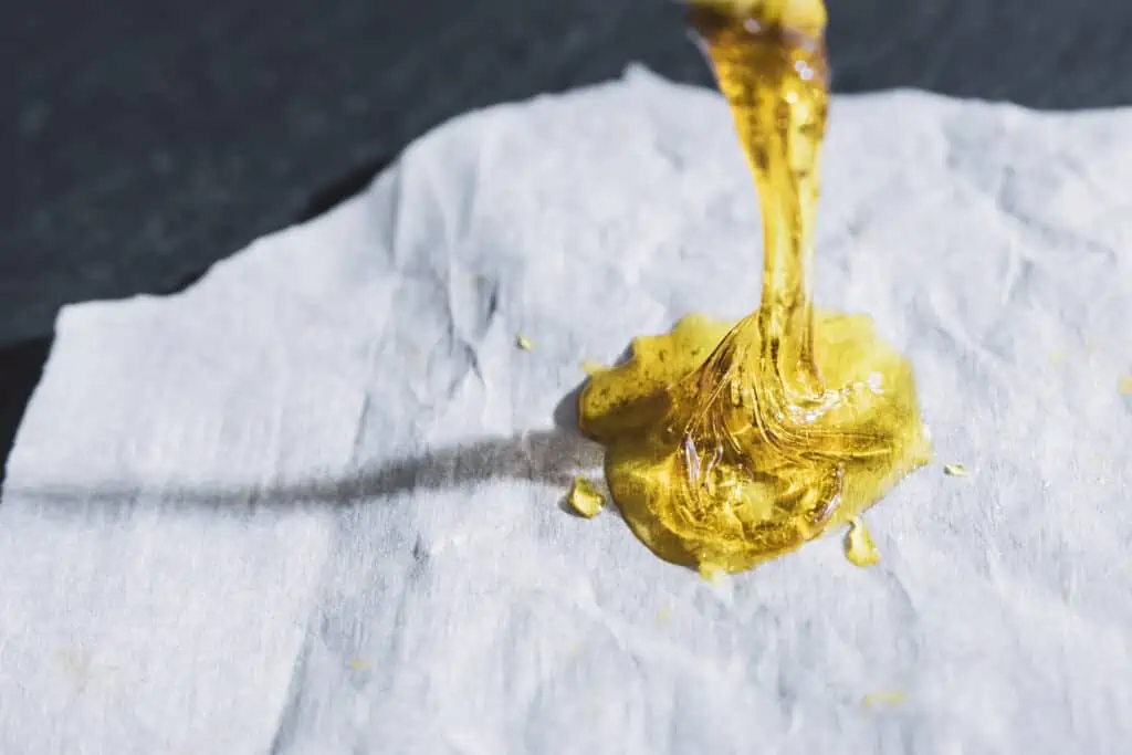 rosin weed concentrate dripping on paper 